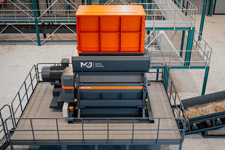M&J F240e electric fine-shredder installed on a steel platform, seen from above